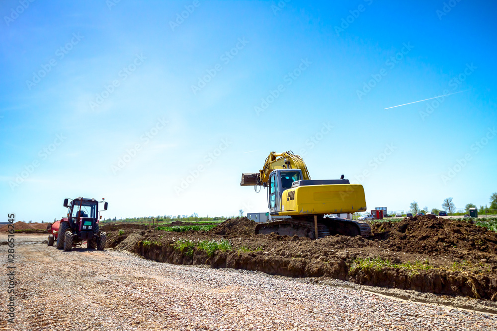 Fototapeta premium Excavator is digging on building site