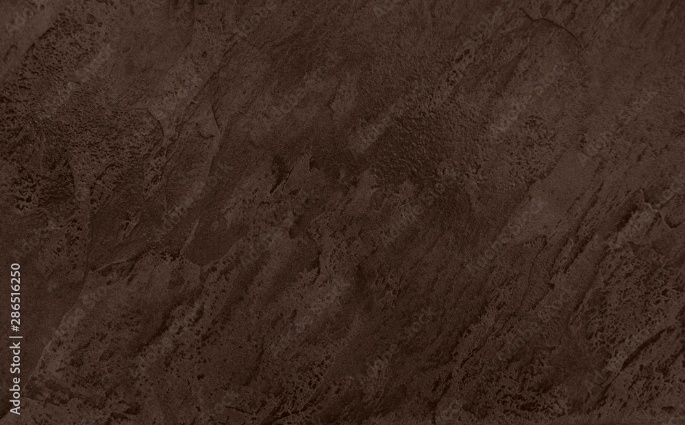 Close up of abstract dark brown stone texture with high resolution.
