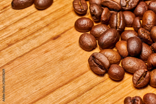 Coffee beans on a wood background isolated 