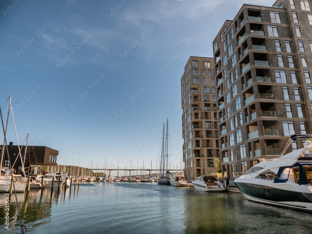 Vejle inner marina harbor with modern apartments and small boats, Denmark