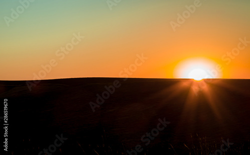 Sunrise in the steppe. Landscape minimalism © kvdkz