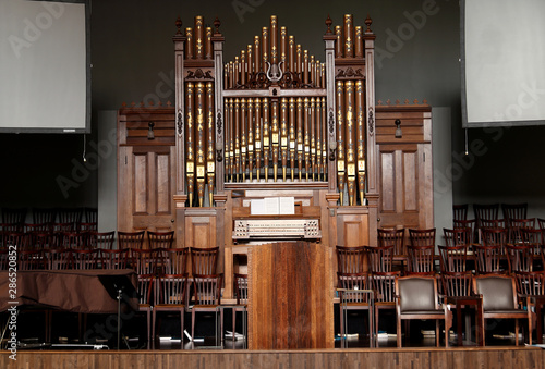 Obraz na płótnie Wooden stage, alter, and pipe organ inside an old church.
