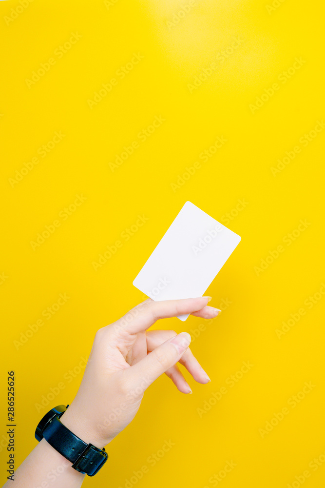 web banner design for business manner and activity concept with beauty woman hand hold name card or credit card in left hand with yellow pastel background
