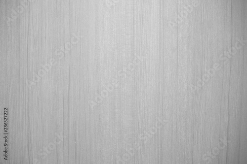 Closeup of beautiful glossy wooden wall in black and white or grey tone with texture for simple background. Cool banner on ad, website, page, and presentation. Monochrome modern pattern