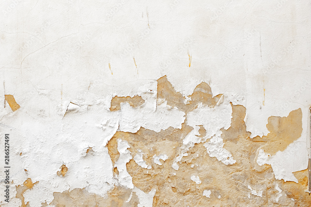 Damaged Old White Paint Wall Scrapped Texture from Old Building in Spain