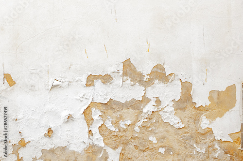 Obraz na płótnie Damaged Old White Paint Wall Scrapped Texture from Old Building in Spain w salonie