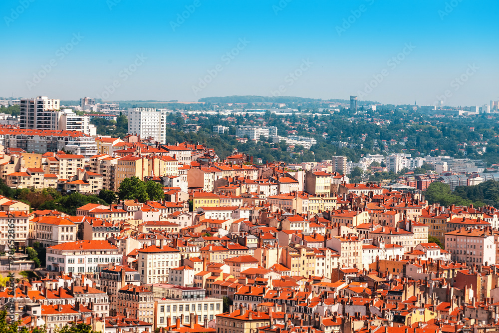 Aerial scenic view of a Lyon city center with orange roofs and skyscrapers