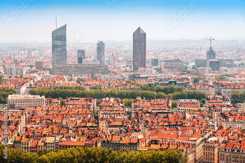 Aerial scenic view of a Lyon city center with orange roofs and skyscrapers