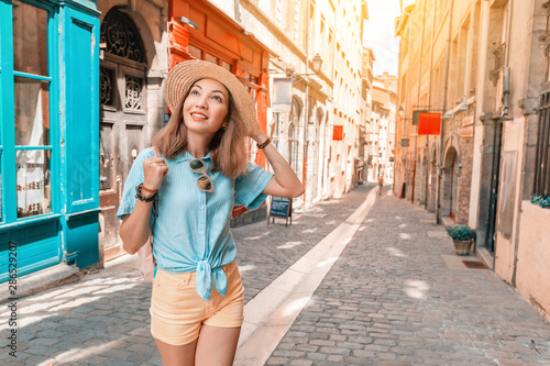 Young carefree girl walking in narrow streets of Lyon old town, Travel and lifestyle in France © EdNurg