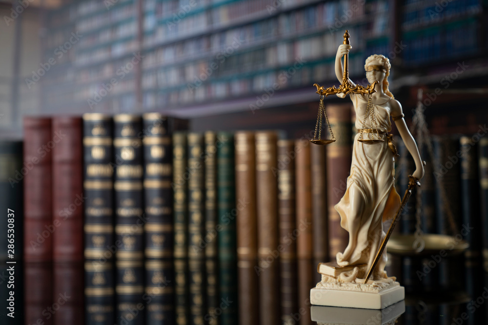 Judge, justice concept background.  Symbol of justice – Themis in the old university library. - obrazy, fototapety, plakaty 
