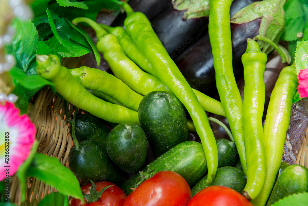 Assortment of fresh vegetables from Farmers market. Healthy food. Assorted fresh vegetables. On a black wooden background. View from above. Pepper, eggplant, cucumber . Assortment of fresh vegetables from Farmers market. Healthy food. Assorted fresh vegetables. On a black wooden background. View from above. Pepper, eggplant, cucumber .