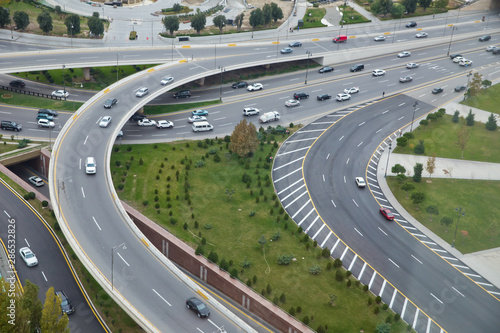 Bridges, roads. Top view . Aerial view of highway and overpass in city .Aerial photo of urban elevated road junction and interchange overpass in city with light traffic