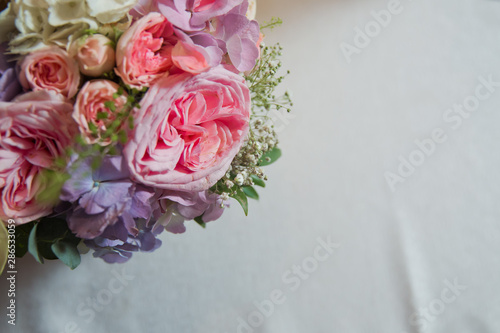 Background with violet,pink peonies on a white background . Pink flower bouquet for text .