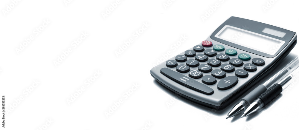 Calculator and pens on white background with some colored keys Calculator and pens on white background with some colored keys