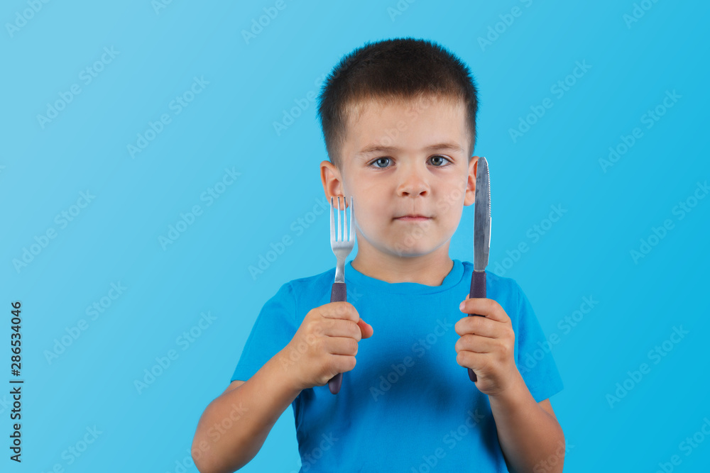 Funny Little Handsome Boy with Fork and Knife. Funny Little Handsome Boy with Fork and Knife.