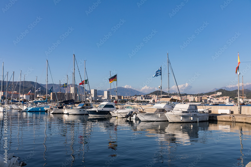 Boats and luxury yachts in Ajaccio harbor, Corsica, France.