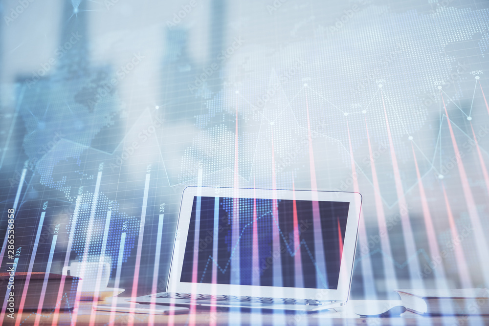 Forex graph hologram on table with computer background. Multi exposure. Concept of financial markets. Forex graph hologram on table with computer background. Multi exposure. Concept of financial markets.