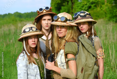 Принти на полотні Four exploring girls dress up as globetrotters