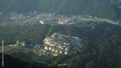 Aerial view of ski resort and alpine village in Mountains in summer. Plateau, buildings, slopes and cableway photo