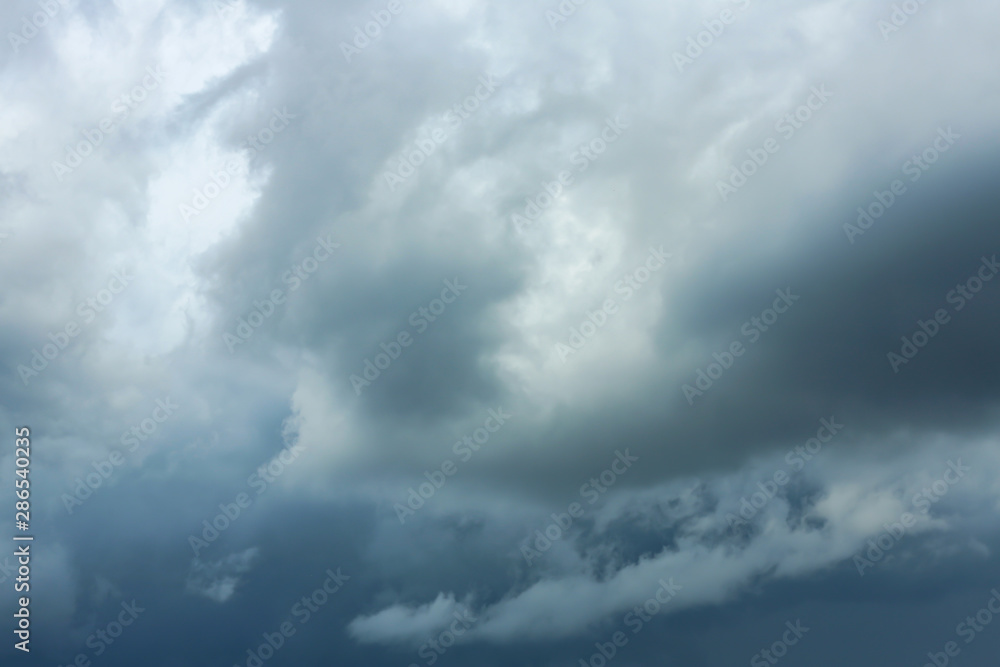 Sky with heavy rainy clouds on grey day