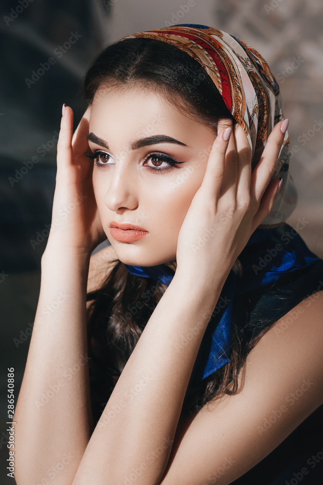 Fototapeta premium Portrait of beautiful brunette girl with makeup 