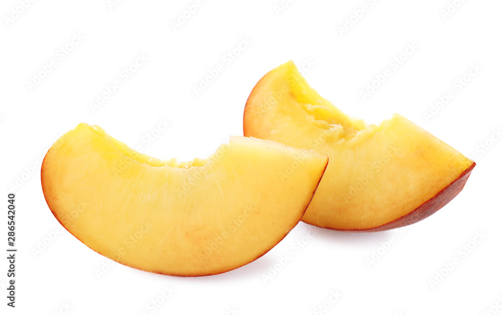 Slices of sweet juicy peach on white background