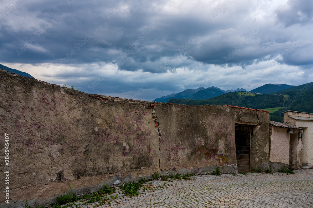 Thundercloud over Old Town of Brunek in Italy