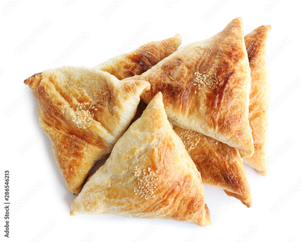 Fresh delicious puff pastry on white background, flat lay