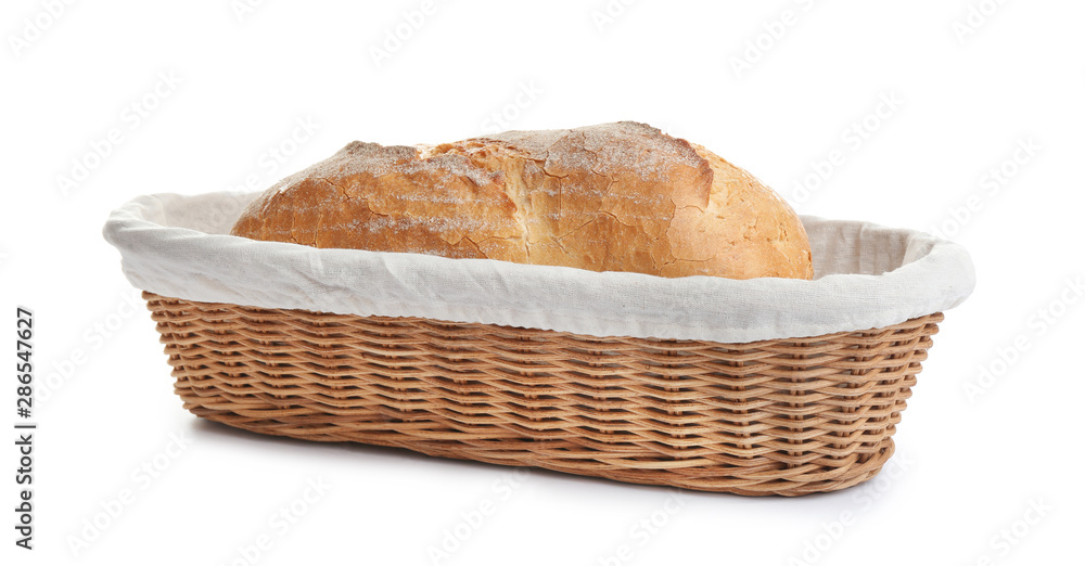 Loaf of tasty fresh bread in wicker basket on white background Loaf of tasty fresh bread in wicker basket on white background