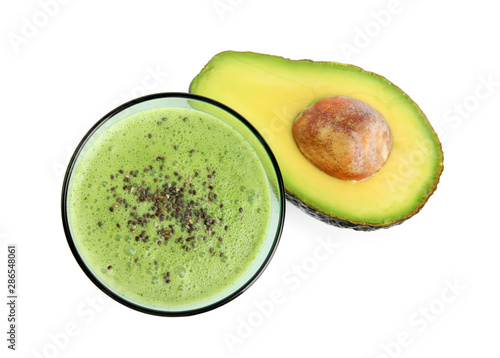 Glass of tasty smoothie with chia seeds and avocado on white background, top view