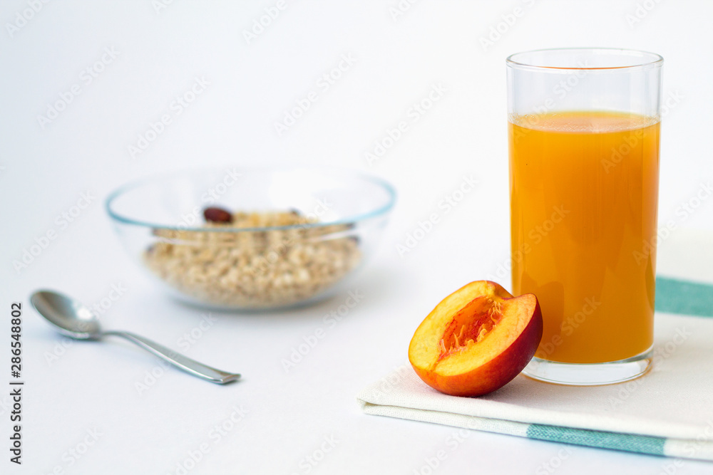 breakfast with fruit and peach juice on white background breakfast with fruit and peach juice on white background