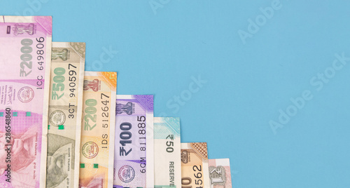Canvas Print Concept of Economic slowdown and Economic growth showing with Indian currency notes in decreasing order according to denomination