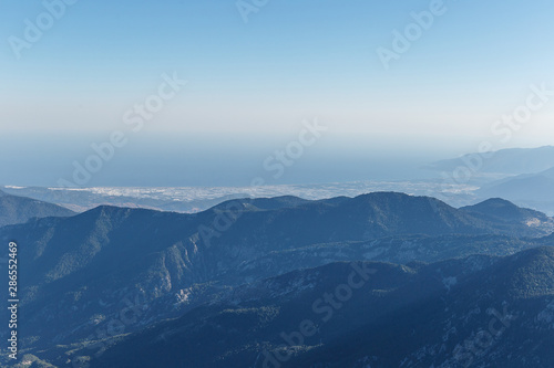 Beautiful landscape in the mountains. Lovely view of the Taurus Mountains and the Mediterranean coast from the top of mount Tahtali. Kemer, Turkey. Postcard view