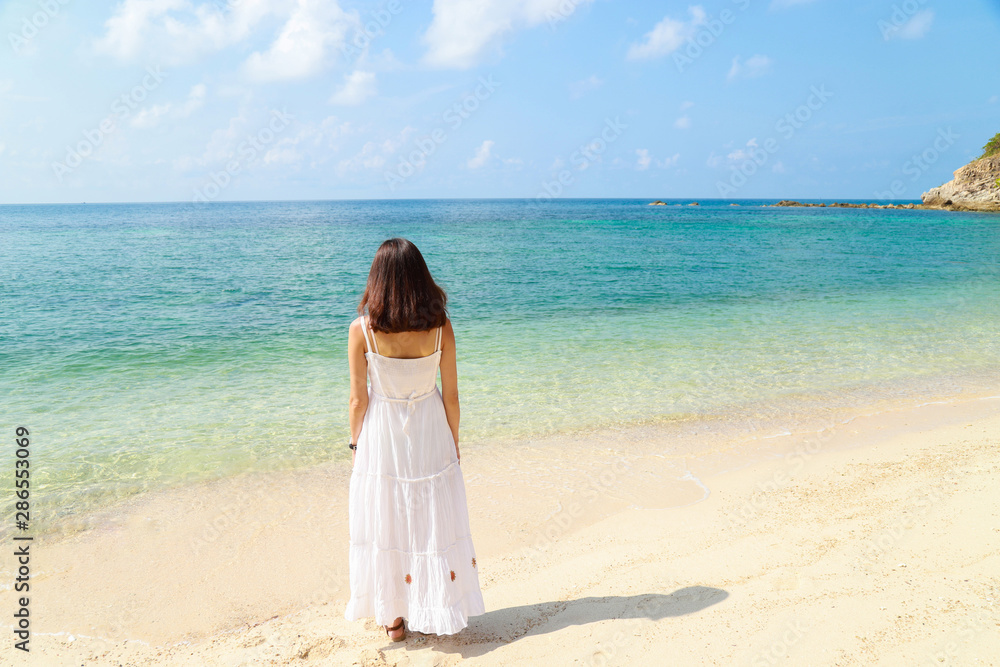 A beautiful broken heart women is alone and feel down on the beach.Valentine's concept. A beautiful broken heart women is alone and feel down on the beach.Valentine's concept.