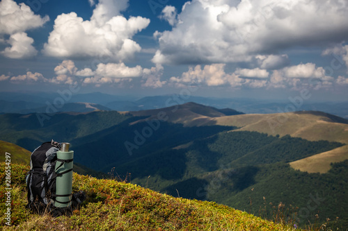 Beautiful mountain landscape with a tourist backpack. Carpathian mountains of Ukraine. Holidays in the mountains.