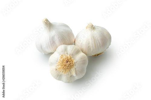 Raw garlic heads isolated on white background close-up