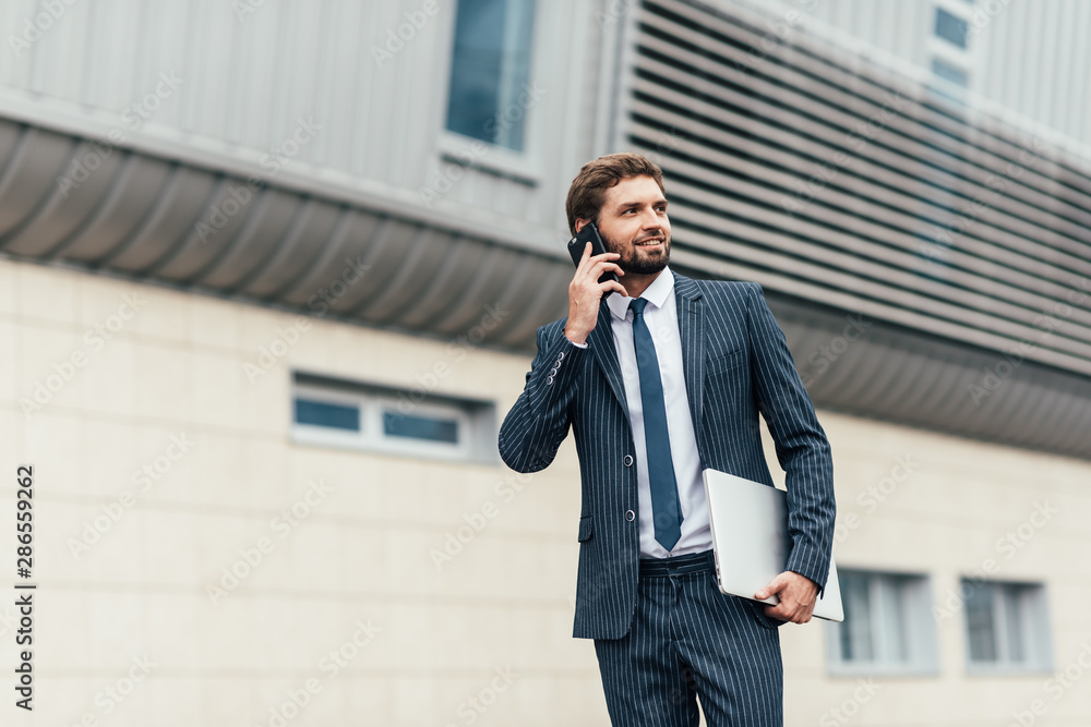 Man speaking by phone at street Man speaking by phone at street