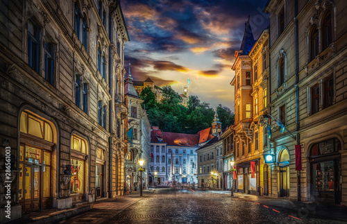 View of the street Stritarjeva  evening city and Ljubljana s castle. Ljubljana  capital of Slovenia.