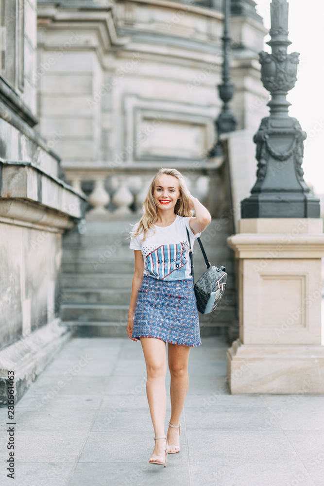 attractions significant places of Germany. beautiful smiling girl in Berlin.