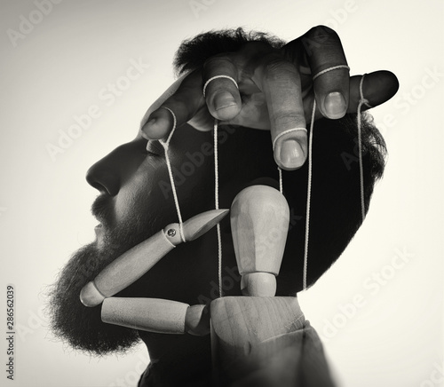 Photos Marionette in male head, black and white