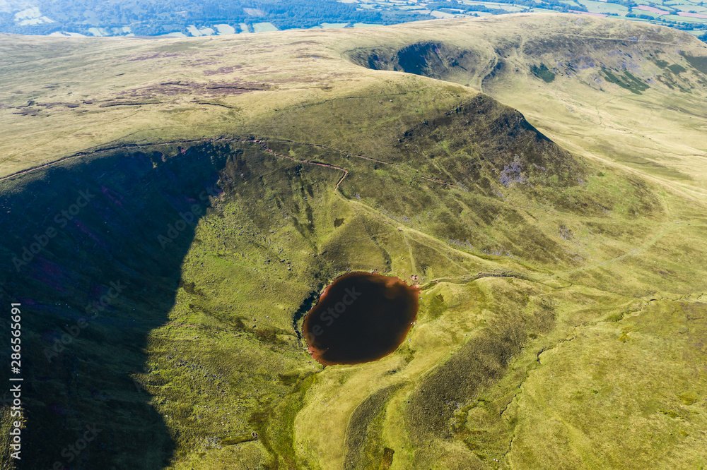 Aerial drone view of the twin peaks of mountains Corn Du and Pen-y-Fan in the Brecon Beacons of Wales, UK - obrazy, fototapety, plakaty 