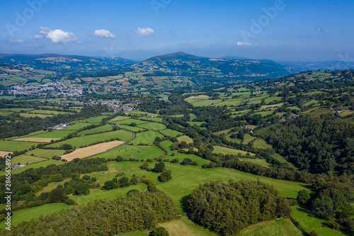 Aerial drone view of farmland and fields in rural Mid Wales, UK