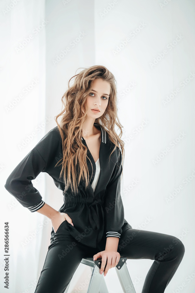 Portrait of beautiful young girl with makeup in black fashion clothes Portrait of beautiful young girl with makeup in black fashion clothes