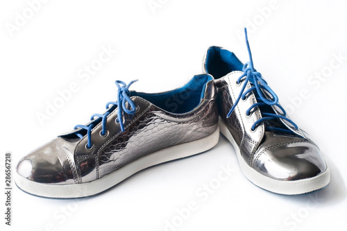 Silver, metallic girls shoes for cold, wet autumn weather photo