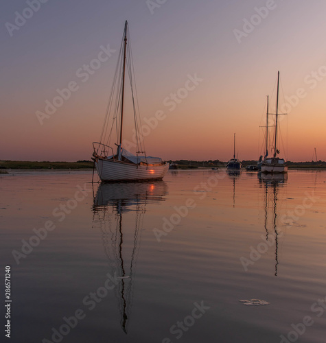 Sunset boats in creek