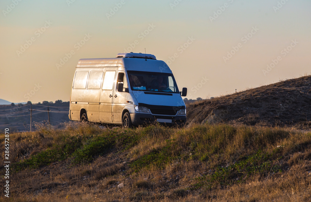 minibus moves to the hills on the road