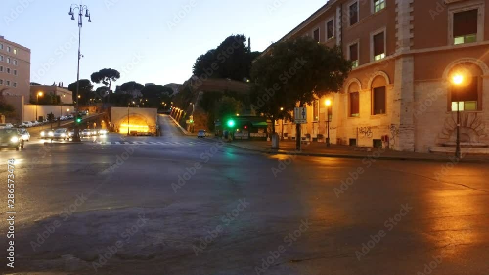 Traffic in sunset in Rome road from tunnel, Via del Traforo under Arch Galleria Principe Amedeo Di Savola