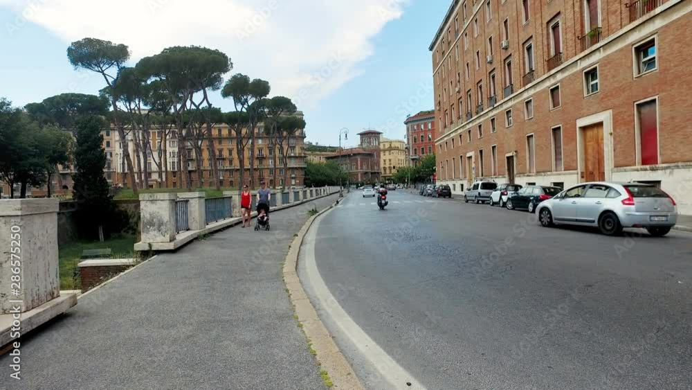 A busy street with rush hour traffic cars traffic in the center of Rome in Italy A busy street with rush hour traffic cars traffic in the center of Rome in Italy