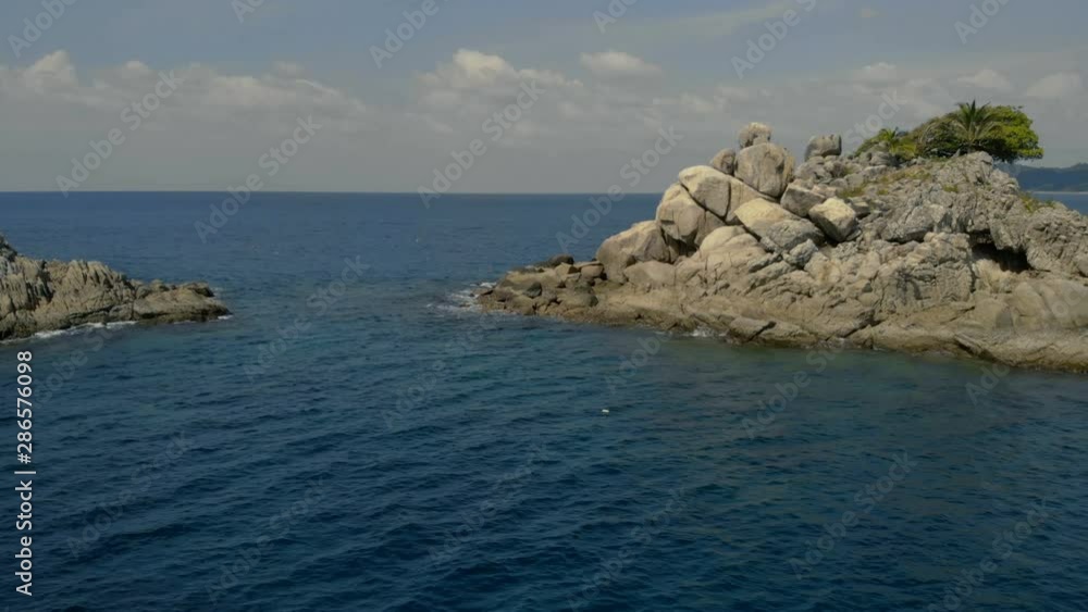 4k small isolated island in the middle of the ocean, rotate drone shot sunshine clear water, beautiful sea water 4k small isolated island in the middle of the ocean, rotate drone shot sunshine clear water, beautiful sea water