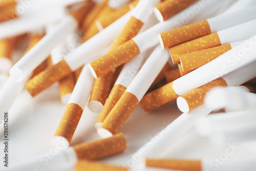 Close up of a smoking cigarettes . cigarette filter tubes photo